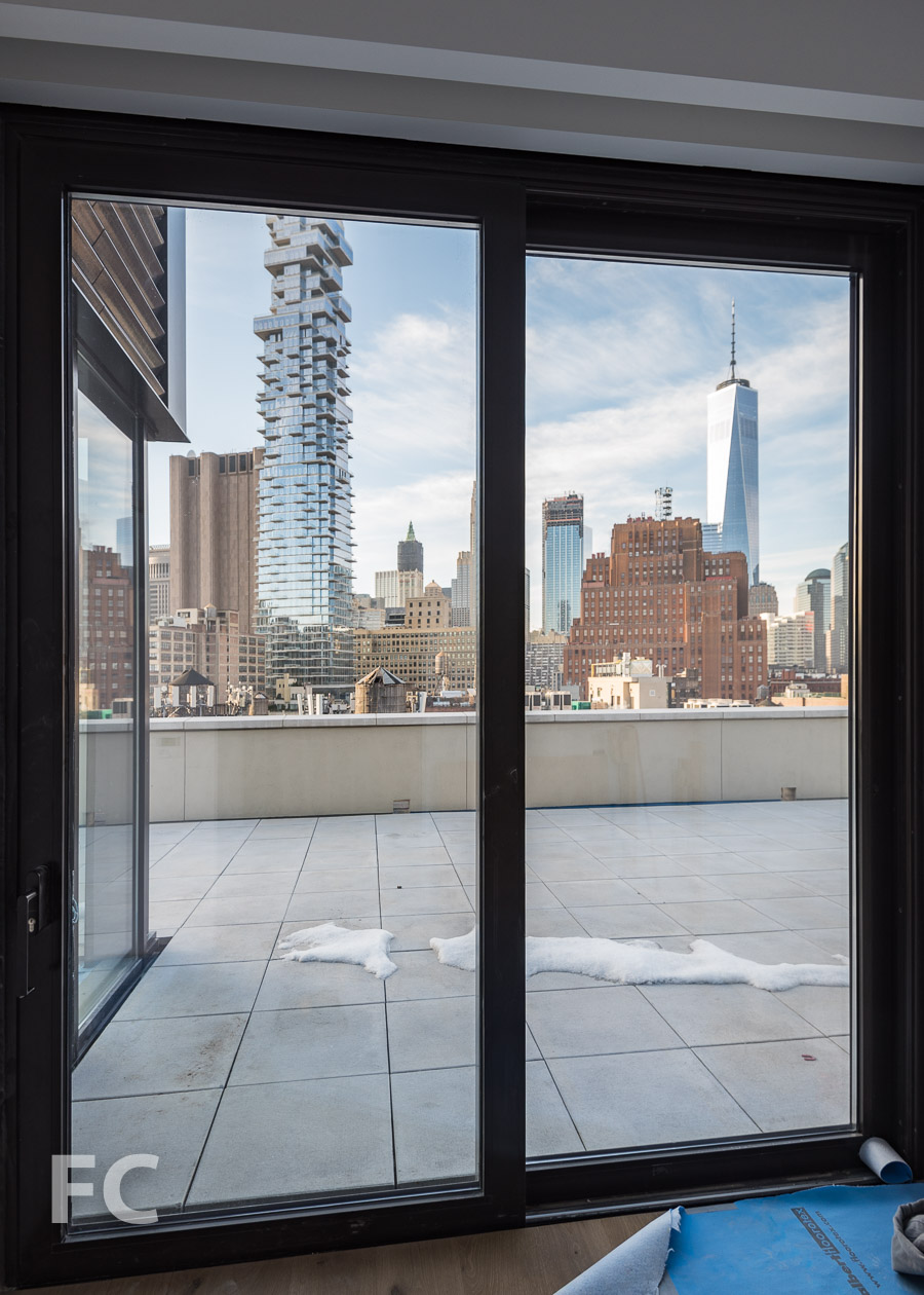 View of the Lower Manhattan skyline from the foyer of the roof terrace of Penthouse B.