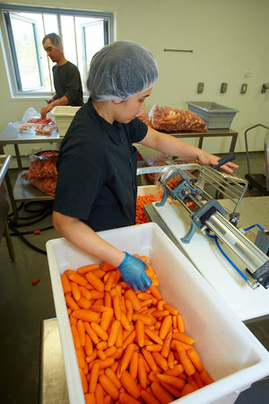 The Farm to Institution program of the Center for an Agricultural Economy’s Food Venture Center provides lightly processed farm products in appropriate portions to make food services and cafeteria serving more efficient.  Photo by Todd Balfour.