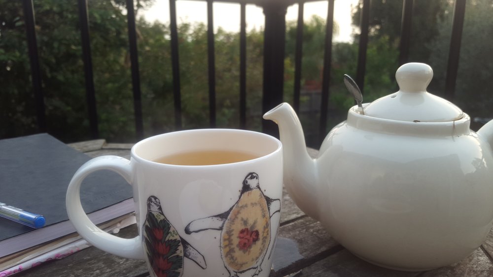 Cathy enjoys a cup of tea outside while watching for birds. Image: Cathy Cavallo.