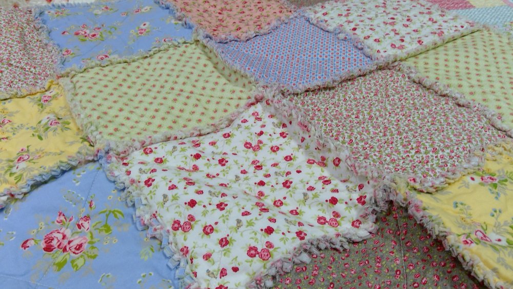 Make a rag quilt with cotton prints.&nbsp; Now this is where the shabby part really comes in.&nbsp; The pretty prints give the chic look. 