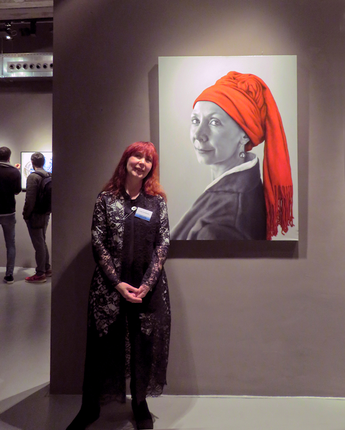 Arina Gordienko next to her painting  The Smile