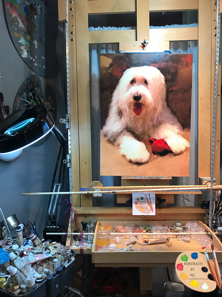 sheepdog painting on easel