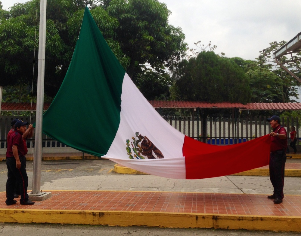  Closing the Mexican chapter of our trip, the Mexican flag is lowered as we cross the border and pass into Guatemala 
