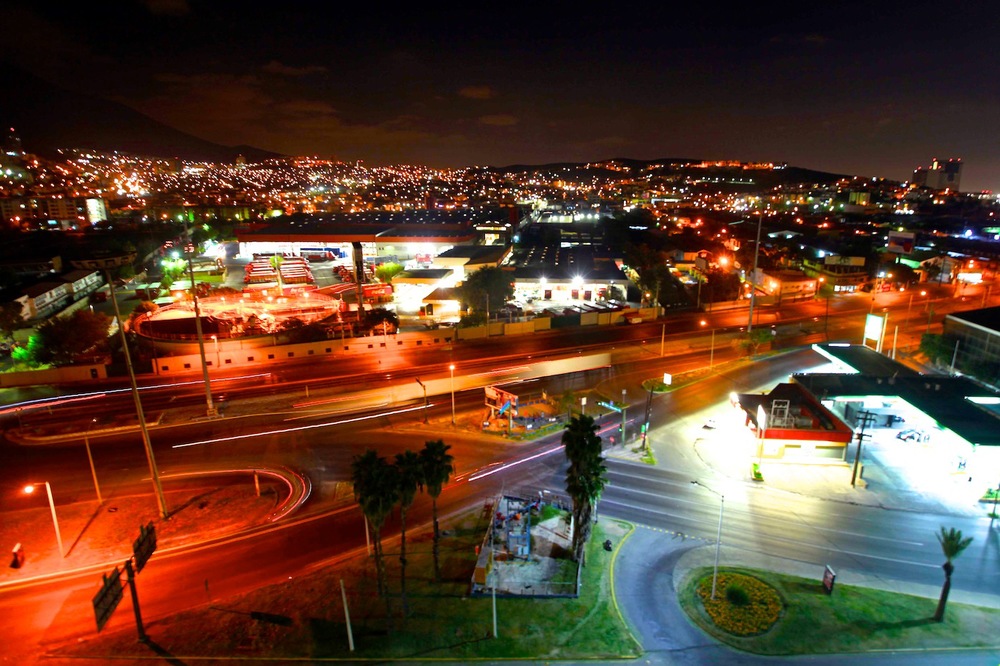  Cars leave streams of light as they rumble around Monterrey at night 