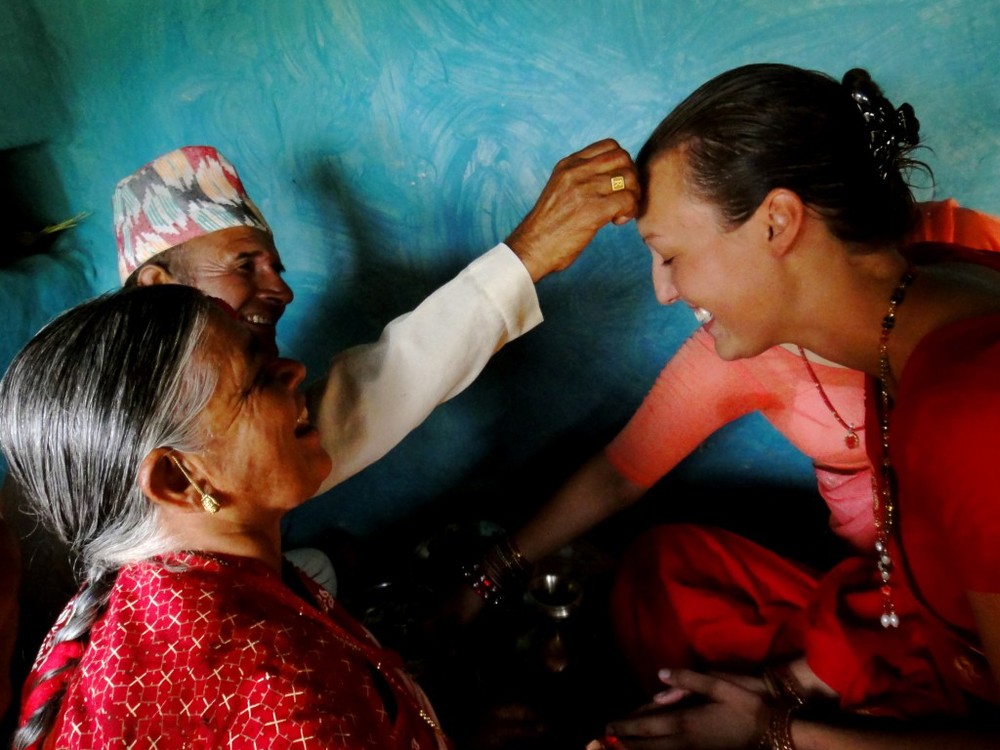  Getting a tikka blessing from her nepali grandparent 