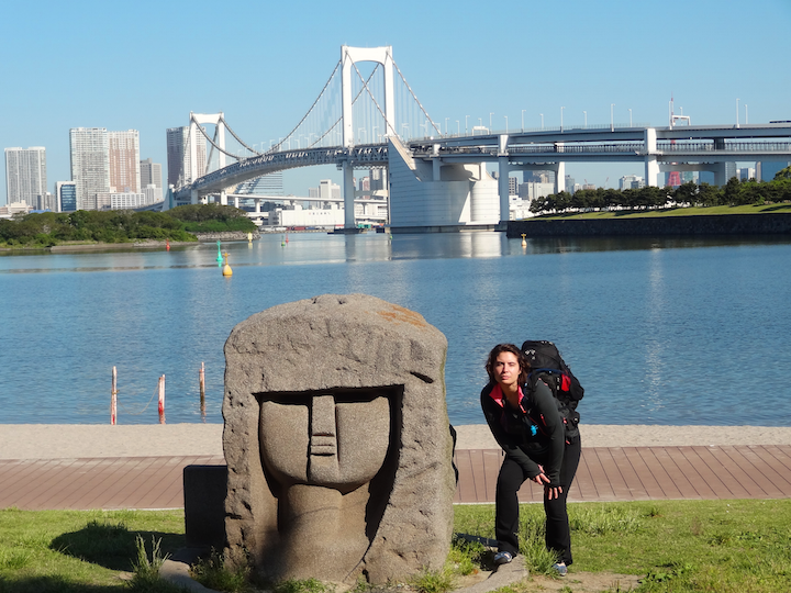   This is Ash trying to mimic a statue on Daiba Island, with Tokyo proper in the backdrop.&nbsp;  