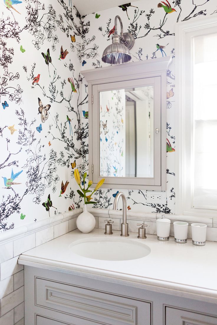 colorful wallpaper in neutral bathroom