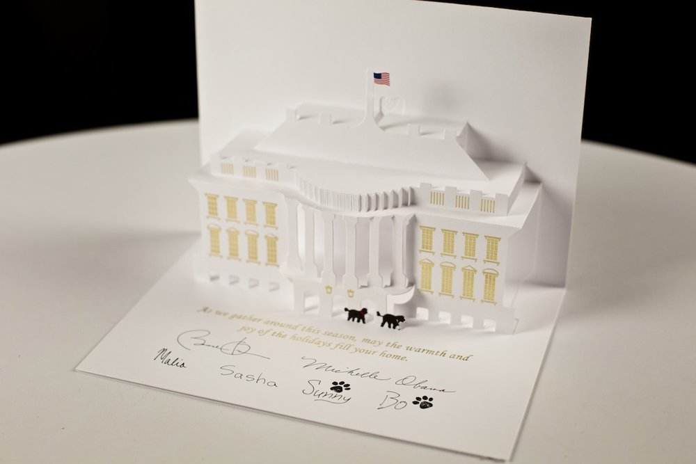 The 2013 Official White House Holiday Card was designed by Chris Hankinson and featured a pop-up White House complete with first dogs, Sunny and Bo.