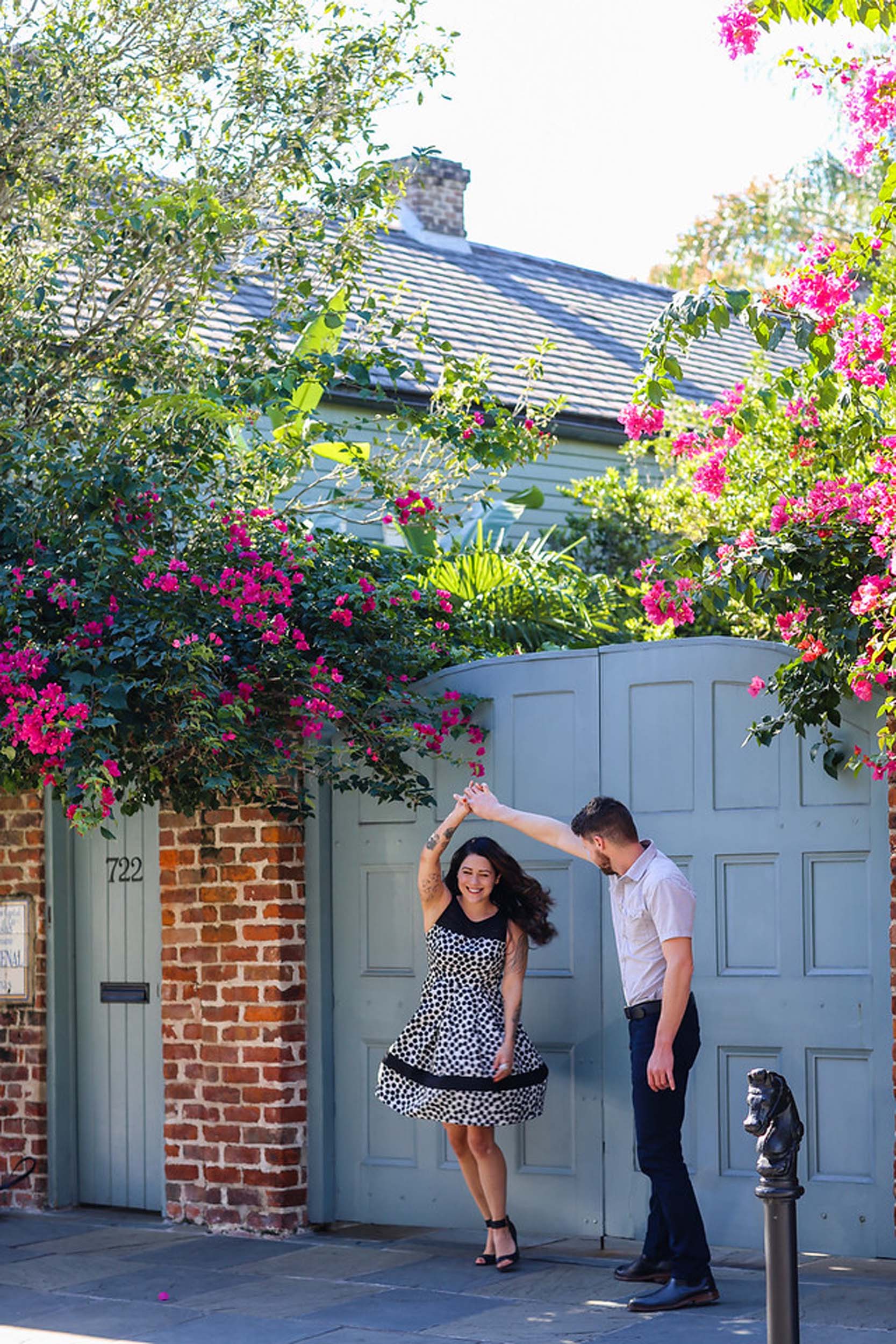 Couple dancing together in alleyway on a couples trip to New Orleans, USA
