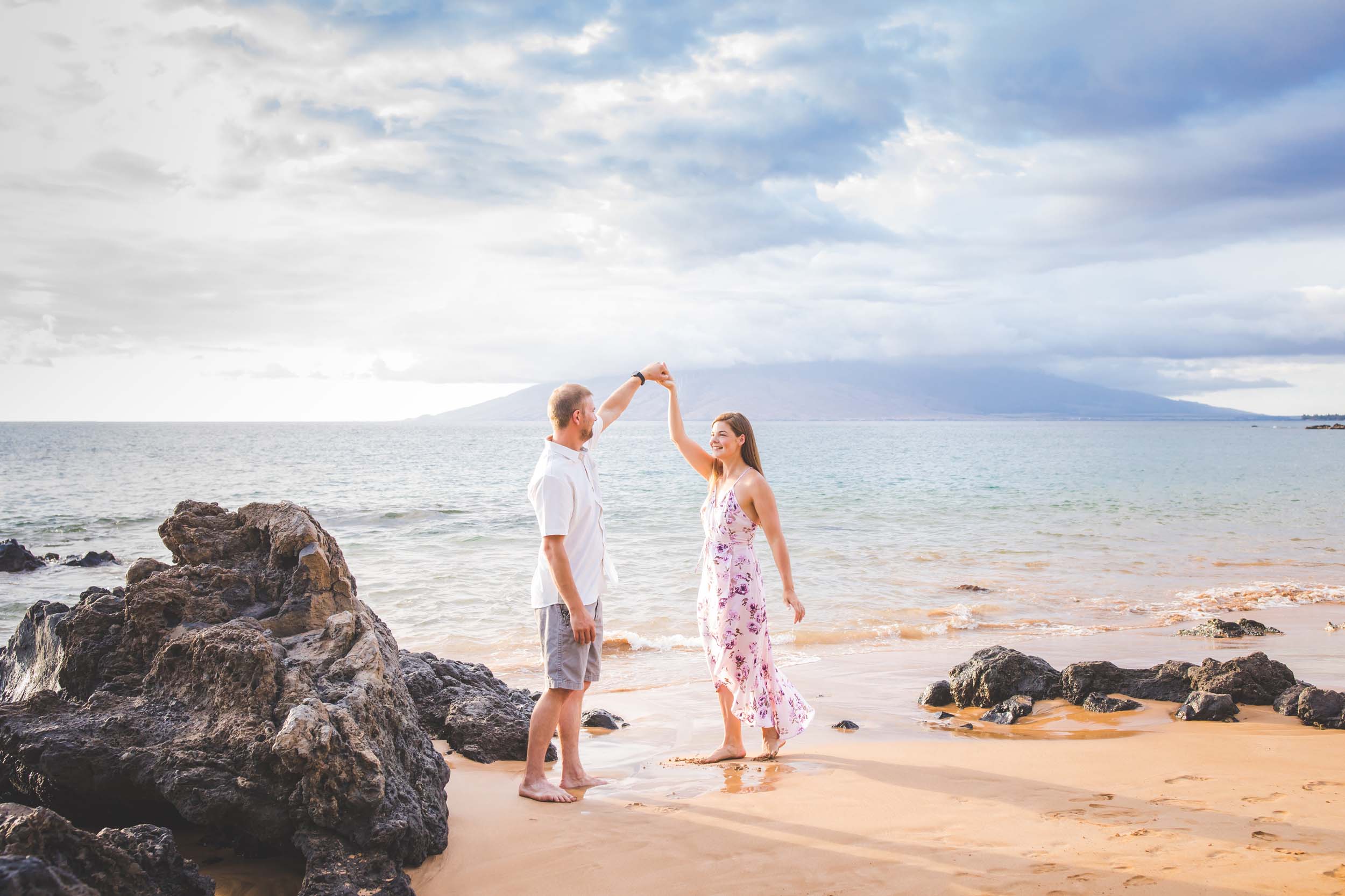 Couple dancing on the beach together in Maui, USA
