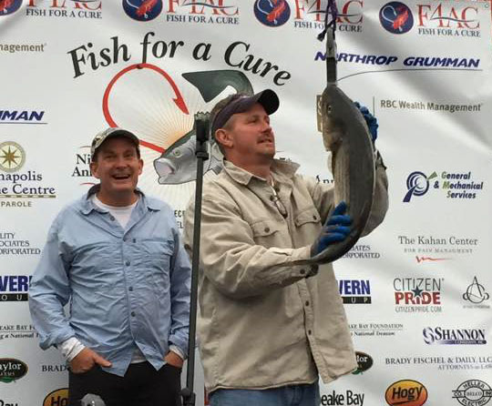 Greg Lilly, on left, supervises the winning weight-in for the 2015 fish for a cure TOURNAMENT at Pussar's of annapolis, MD.