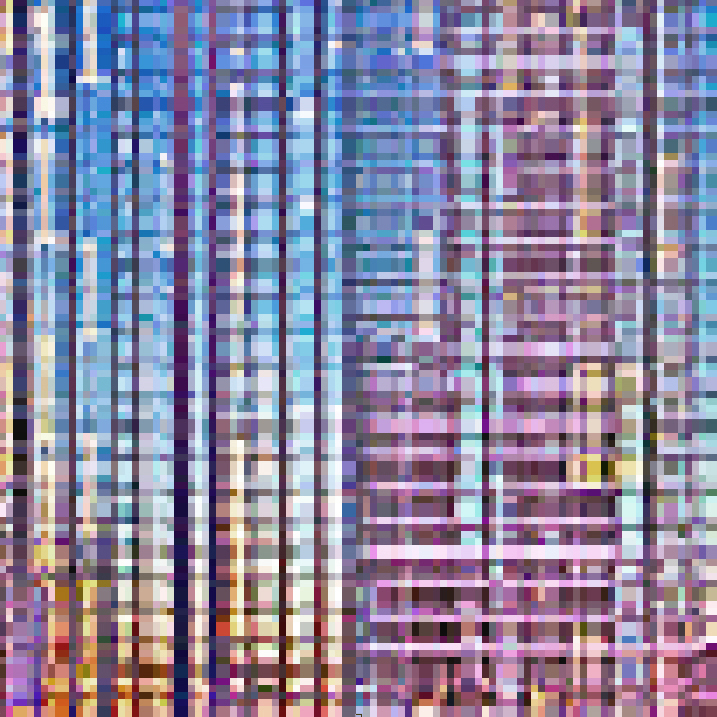 Low-resolution (pixellated) image of a high-rise building, at sunset.