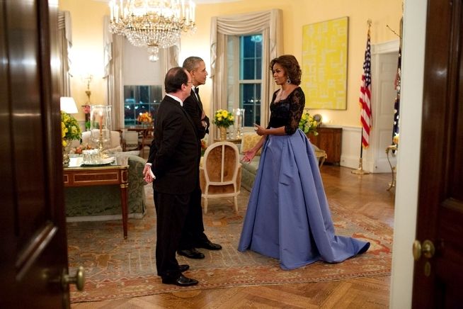 First Lady Michelle strikes a pose in her Carolina Herrera gown, one of her best looks by the way, while chatting with I think Fançois Hollande, President of France in the Yellow Oval Room