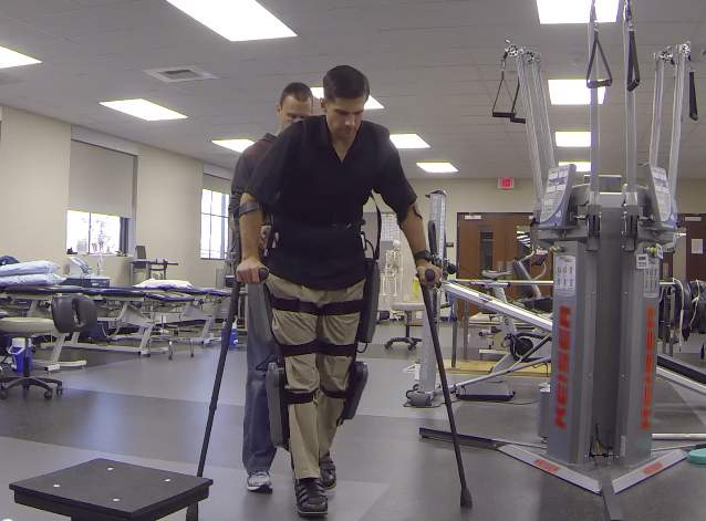 Derek Herrera walks using his ReWalk ExoSkeleton. The $69,500 device has a top speed of 1.3 mph. (Courtesy of Derek Herrera)