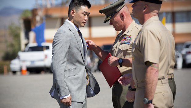 During a ceremony at 5th Marines in Camp Pendleton, Jonathan Kong is awarded the Silver Star from Maj. Gen. Lawrence Nicholson. Kong was a Hospital Corpsman Second Class while serving in the U.S. Navy and assigned to 1st Battalion, 5th Marines when he was deployed to Sangin, Afghanistan. — Nelvin C. Cepeda / UT San Diego/Twitter @NelCepeda