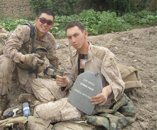 HM3 Jonathan Kong and Cpl. Michael Dawers in Sangin, Afghanistan in 2011. (USMC released.)