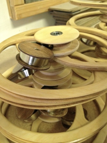 Constant Force Spring closeup on kinetic sculpture by David C. Roy of Wood That Works
