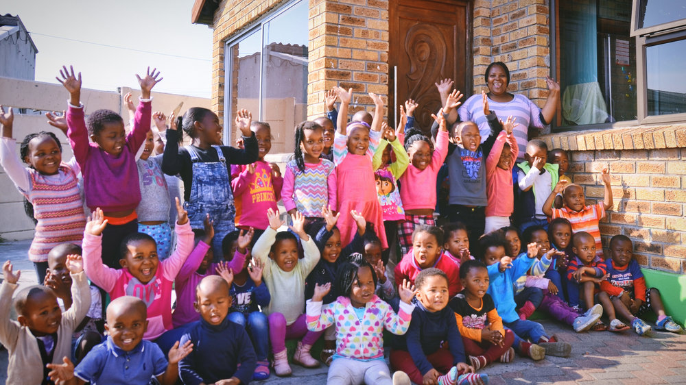 ‘Hand’s up high’: Ncumisa and some of her pupils