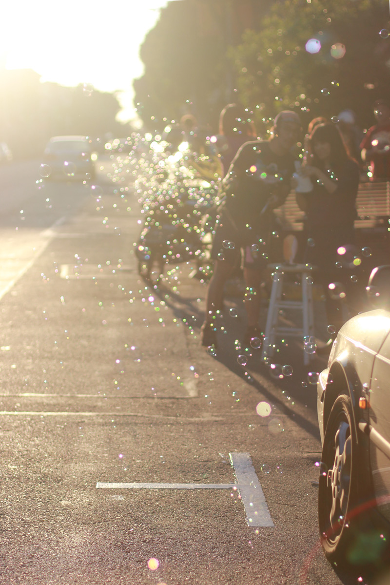 Biking through bubbles on Haight Street in San Francisco