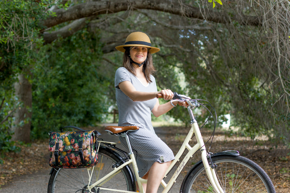 Mom keeps her dress from flying up with her Tandem NY Skirt Weight. Very useful for biking prettily!
