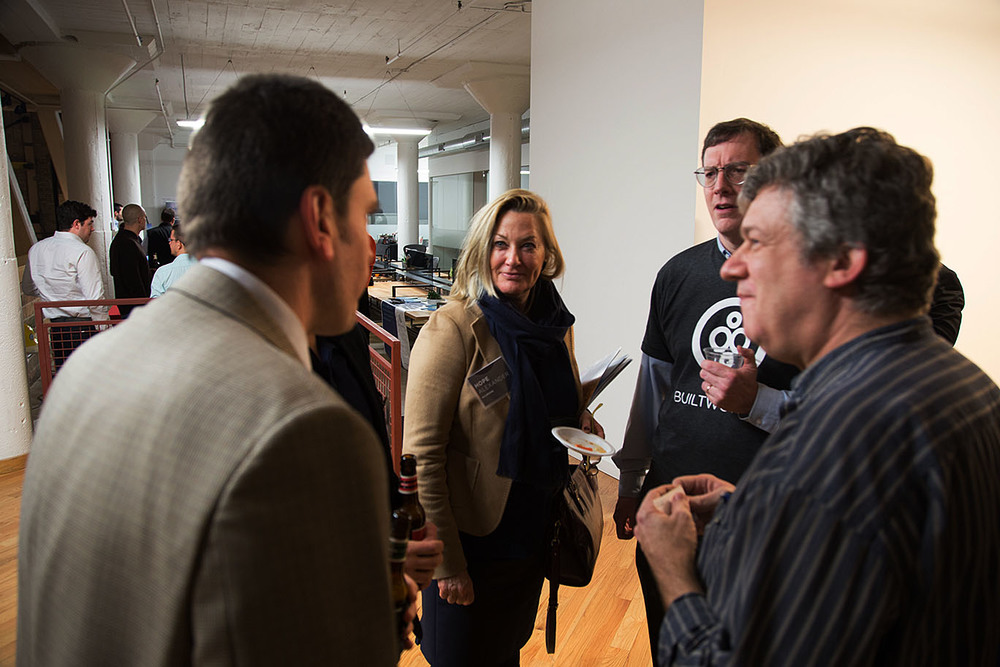  From left, Dr.&nbsp;Theo Tryfonas from the University of Bristol chats with Hope Alexander of Walbridge , Rob McManamy of BuiltWorlds, and Charlie Catlett, of Argonne National Laboratory and the University of Chicago .&nbsp; 