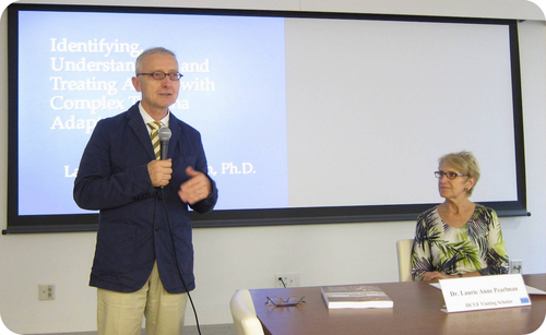 ICU Professor John Maher introduces JICUF Visiting Scholar Dr. Laurie Pearlman at an event commemorating the 20th anniversary of the Rwandan Genocide.