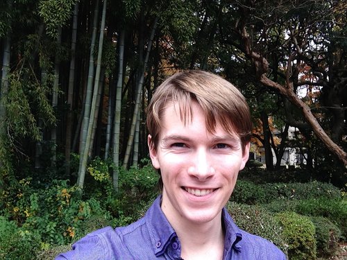 Tim Fraser in front of a bamboo grove at ICU