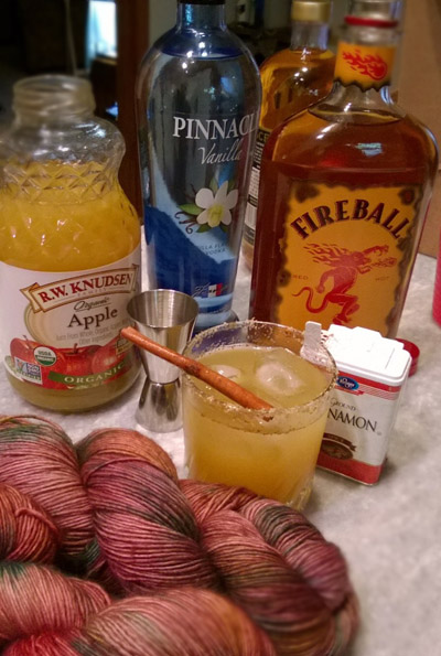  The makings of a lovely autumn cocktail and some of our fall colored yarn. (Dulcet) 
