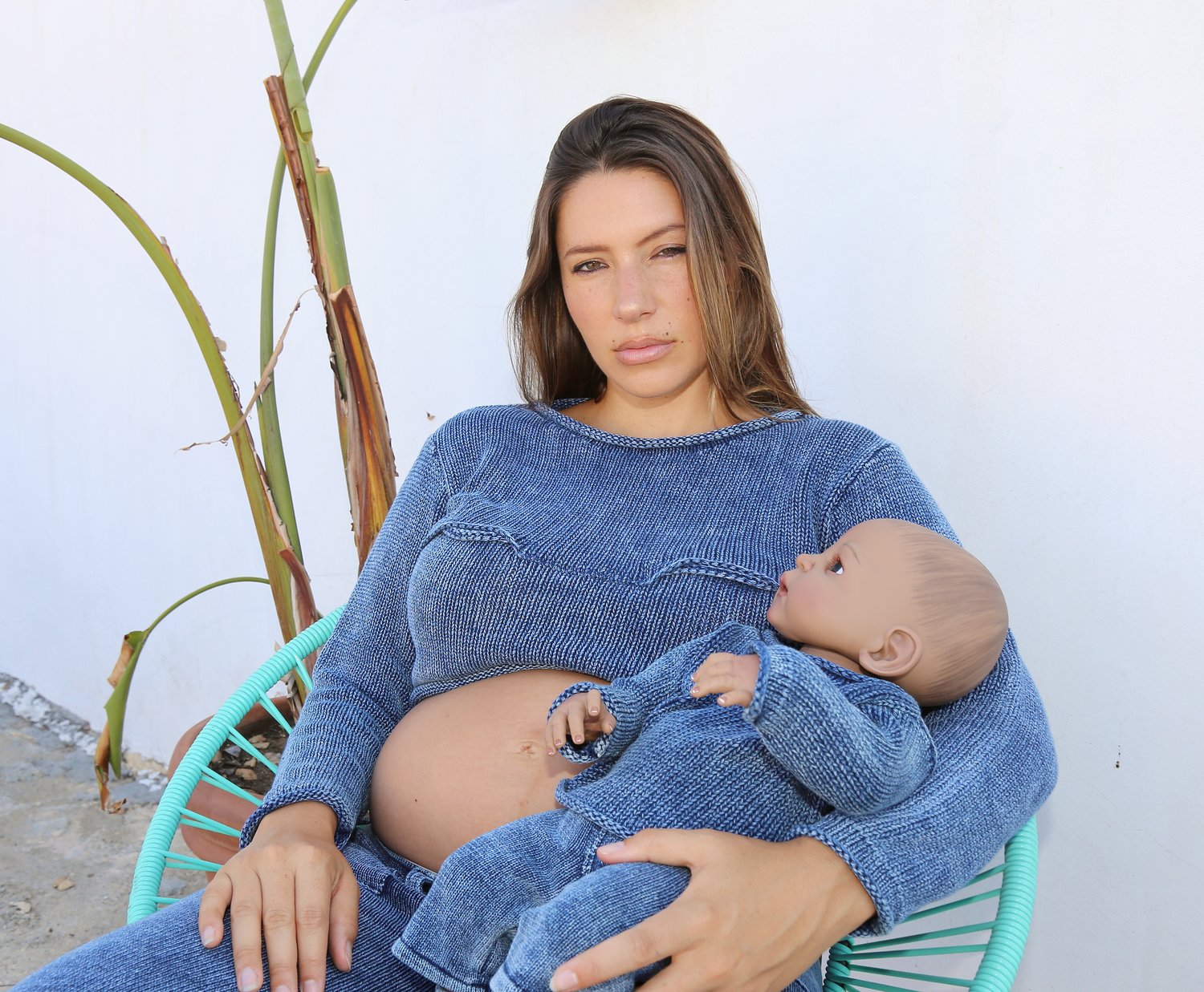 Sylvia Kochinski wearing the new Knorts Mommy and Me breastfeeding sweater with matching Knorts baby, Knorman.