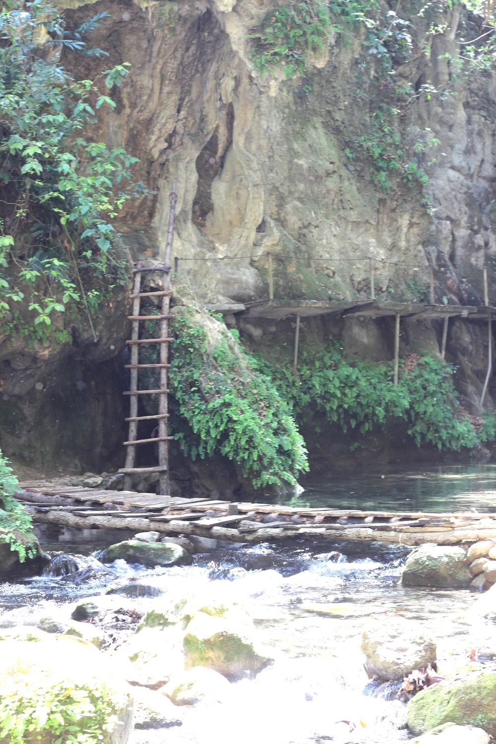 Ladder to foot bridge to more ladders across rivers on the way to Puente de Dios