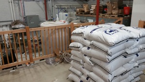  Bags of locally malted grains from Blue Ox are ready to go at at Lone Pine Brewing Company in Portland. 