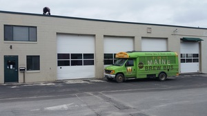  Testing to see how it will look with our buses (we didn't see the guy on the roof until after we took the pic). The building was once part of the Merrill Transport complex and was designed for tractor trailer repair. 