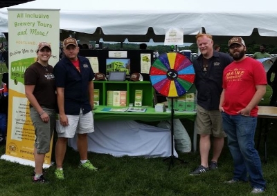 Our Road Team with our display at an outdoor festival last year.