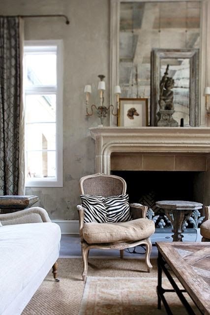 Just a bit of zebra adds some graphic interest....(I know, not leopard - but I like it!  The mantel styling is good, too)