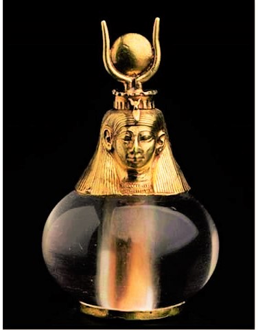 crystal quartz and solid gold adorned bottle used for fragrant oils with the bust of Goddess Het-Heru (Hathor)