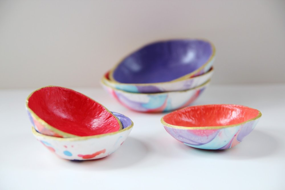 Use nail varnish and air dry clay to make these marbled bowls.