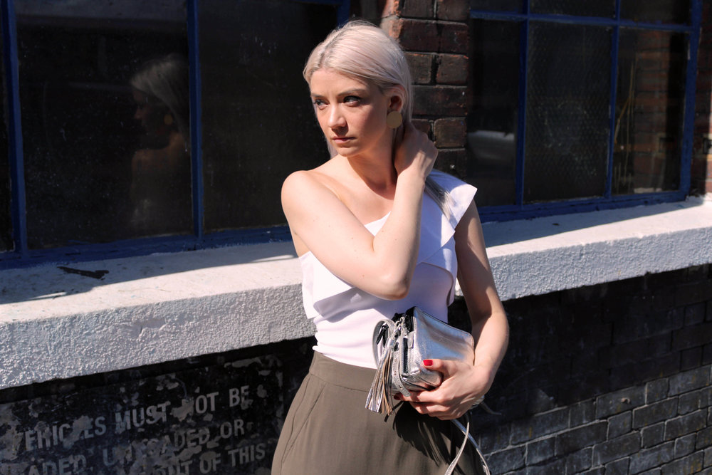 one shoulder top, khaki trousers, silver bag, northern magpie