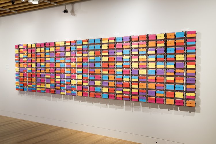  Rebecca Baumann,  Automated Colour Field (Variation 8) , 2017, 140 clock and archival colour card, 1290 x 5030 x 90 mm, edition of 3 plus a/p. Collection of the Museum of New Zealand Te Papa Tongarewa. Image courtesy of the artist and the Museum of New Zealand Te Papa Tongarewa. Photo: Maarten Holl 