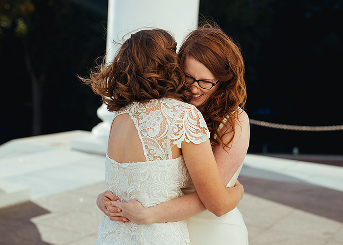 two brides hug after wedding in richmond virginia