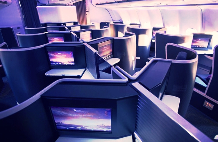 What are some ways to save on business-class flights?