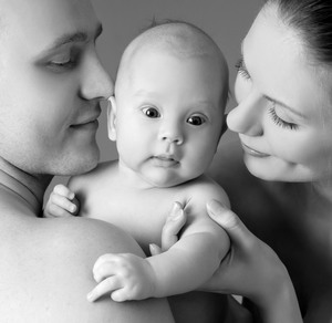 Mother, father and baby in black and white