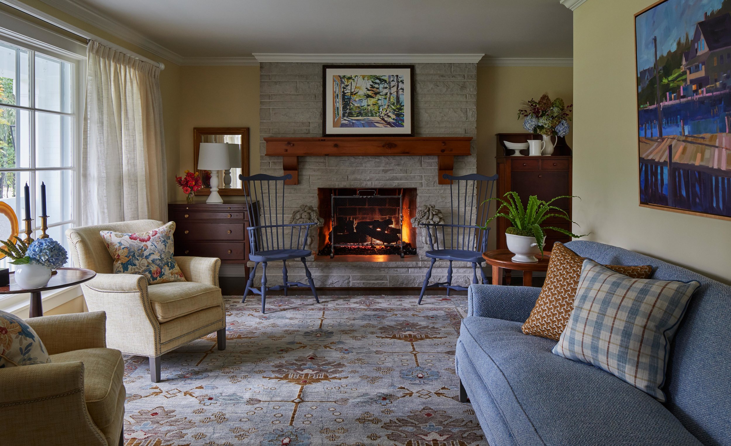 Classic living room with cozy fireplace and blue accents. Come see more interior design inspiration from Elizabeth Drake. Photo by Werner Straube. #interiordesign #classicdesign #traditionaldecor #housetour #elizabethdrake