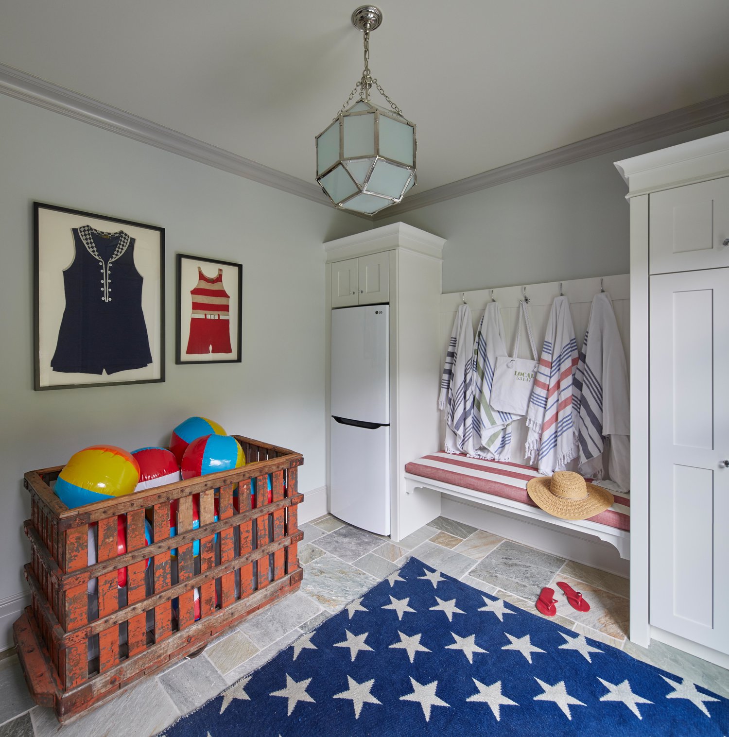 Cheerful red, white and blue pool cabana or mud room with star rug. Come see more interior design inspiration from Elizabeth Drake. Photo by Werner Straube. #interiordesign #classicdesign #traditionaldecor #housetour #elizabethdrake