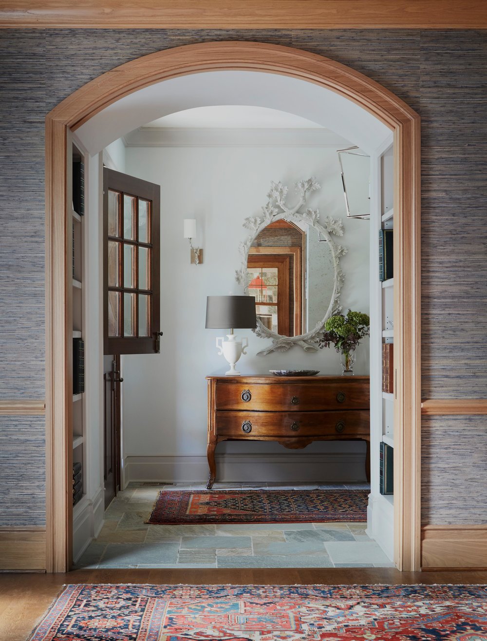Entry with dutch door, stone floor, and antiques. Come see more interior design inspiration from Elizabeth Drake. Photo by Werner Straube. #interiordesign #classicdesign #traditionaldecor #housetour #elizabethdrake