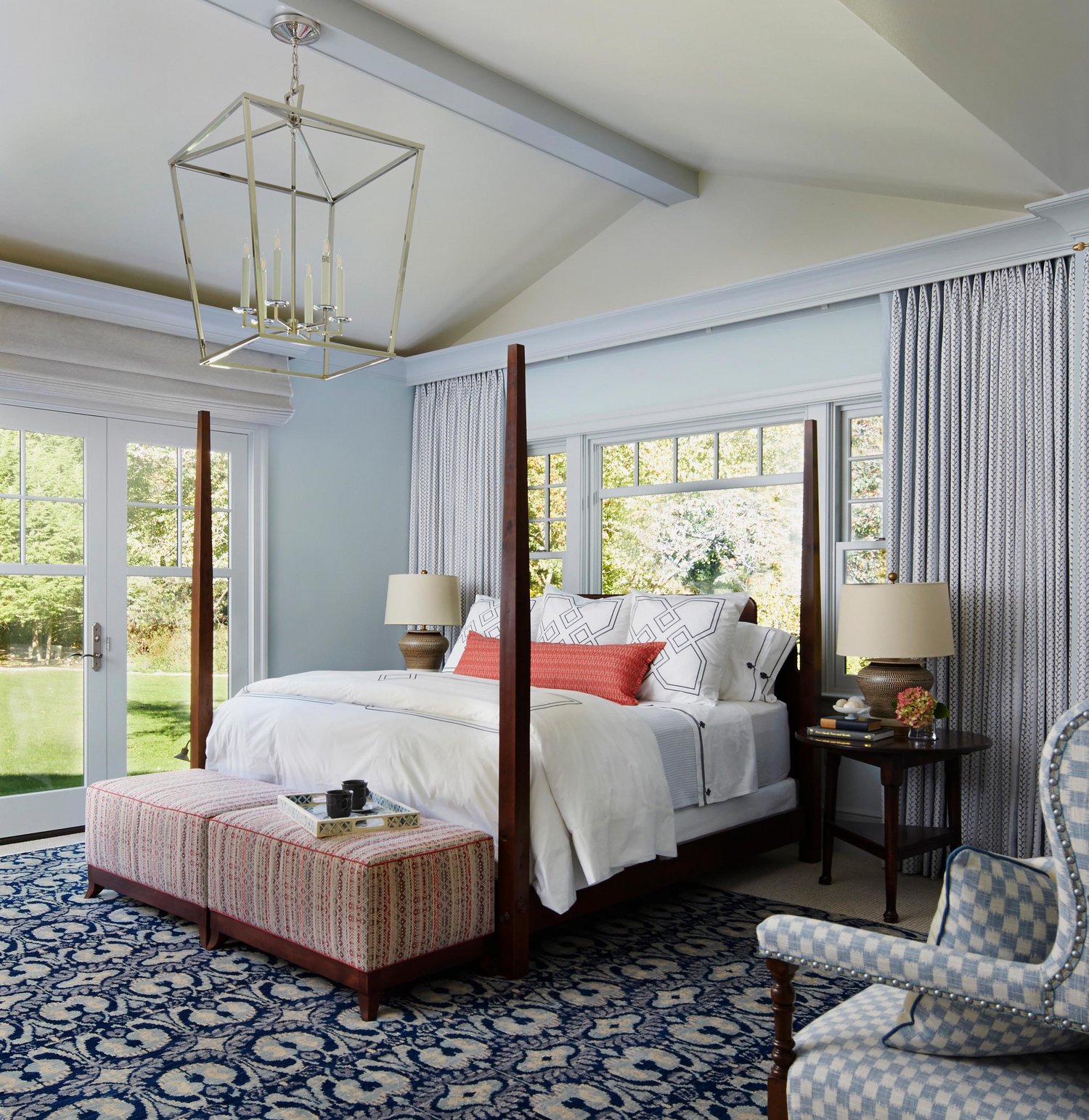 Traditional style bedroom with blue and pops of coral. Come see more interior design inspiration from Elizabeth Drake. Photo by Werner Straube. #interiordesign #classicdesign #traditionaldecor #housetour #elizabethdrake
