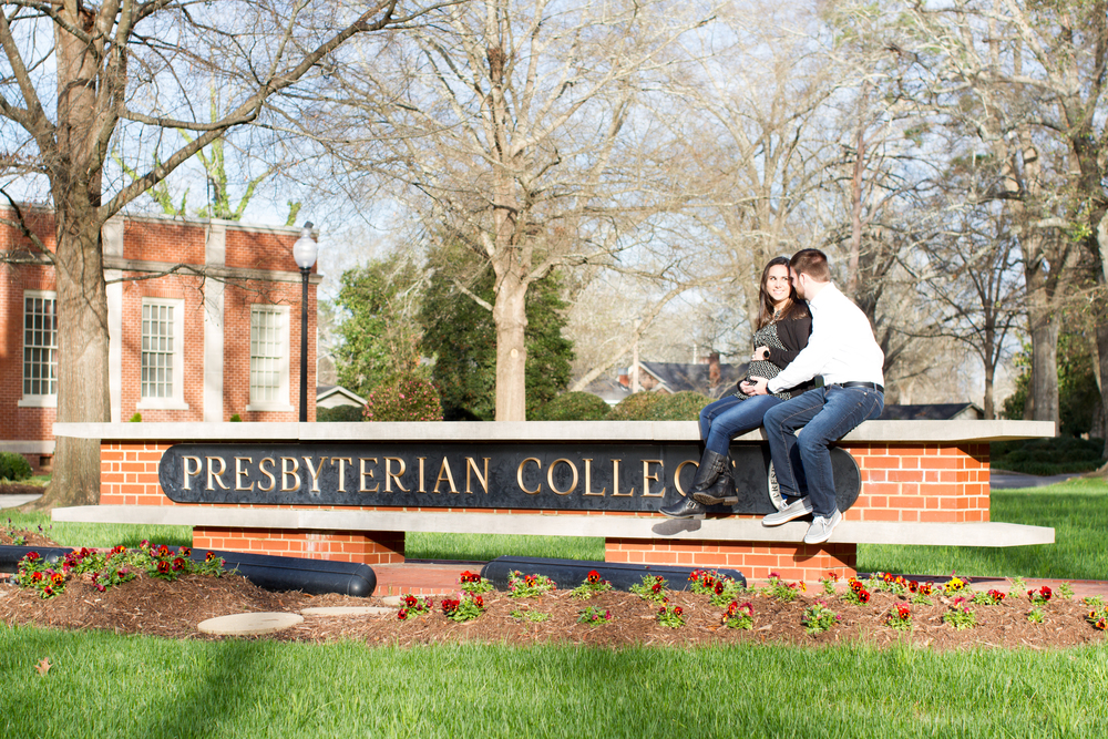 Photo of Expecting Parents sitting on Presbyterian College Sign