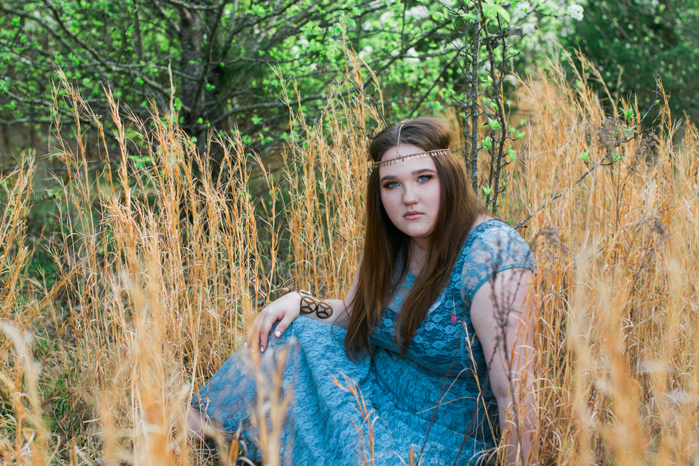 Sitting in a field portrait for Senior Pictures