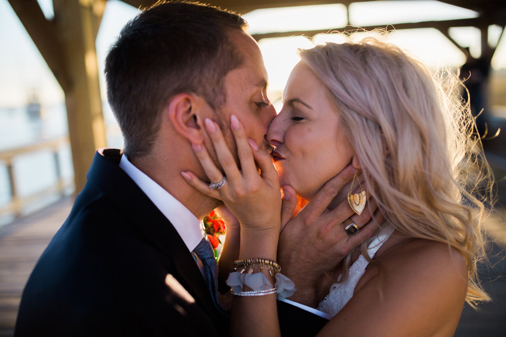 Bride and Groom kissing after Wedding