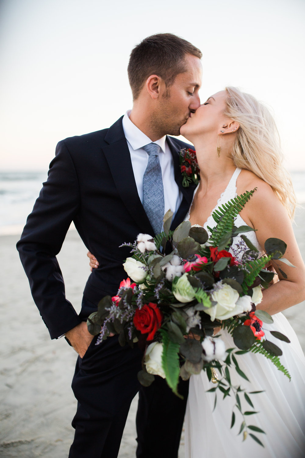 Bride and Groom kissing on the Shore