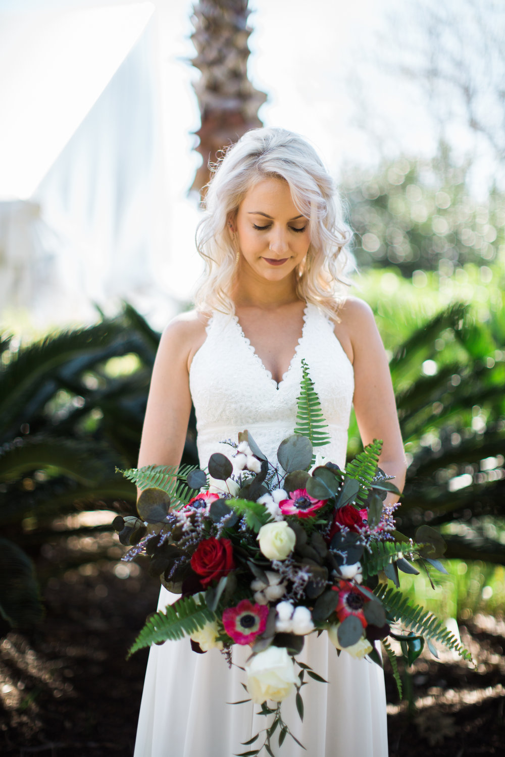 Bride with flower arrangement